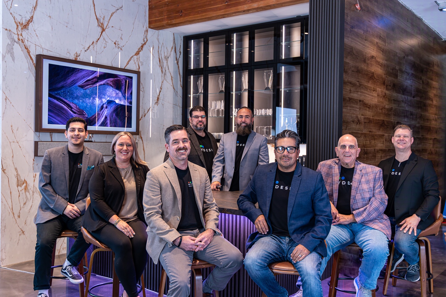 ByDesign team around the bar at the Experience Center